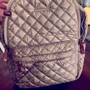 The lighting is weird but it’s pink! Used pink backpack! Mz Wallace